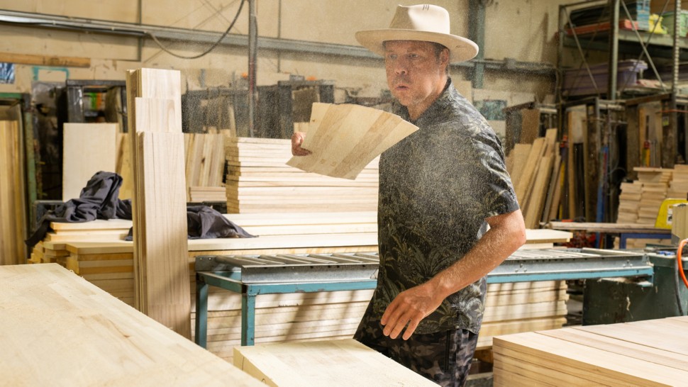 Travis in the Core Shop dusting off the beginnings of his next dream board