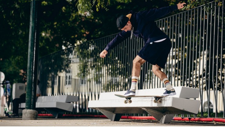 Sliding with a skateboard on a bench in the skatepark