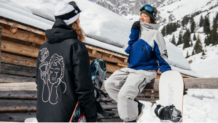 A group of female snowboarders wear good snowboard jackets